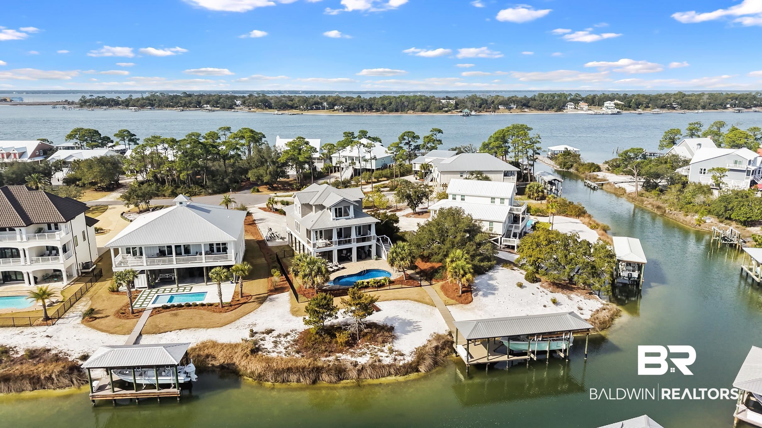 33186 Marlin Key Drive Orange Beach, AL 36561 - Photo 4 of 87 Aerial perspective of suburban area featuring a large body of water