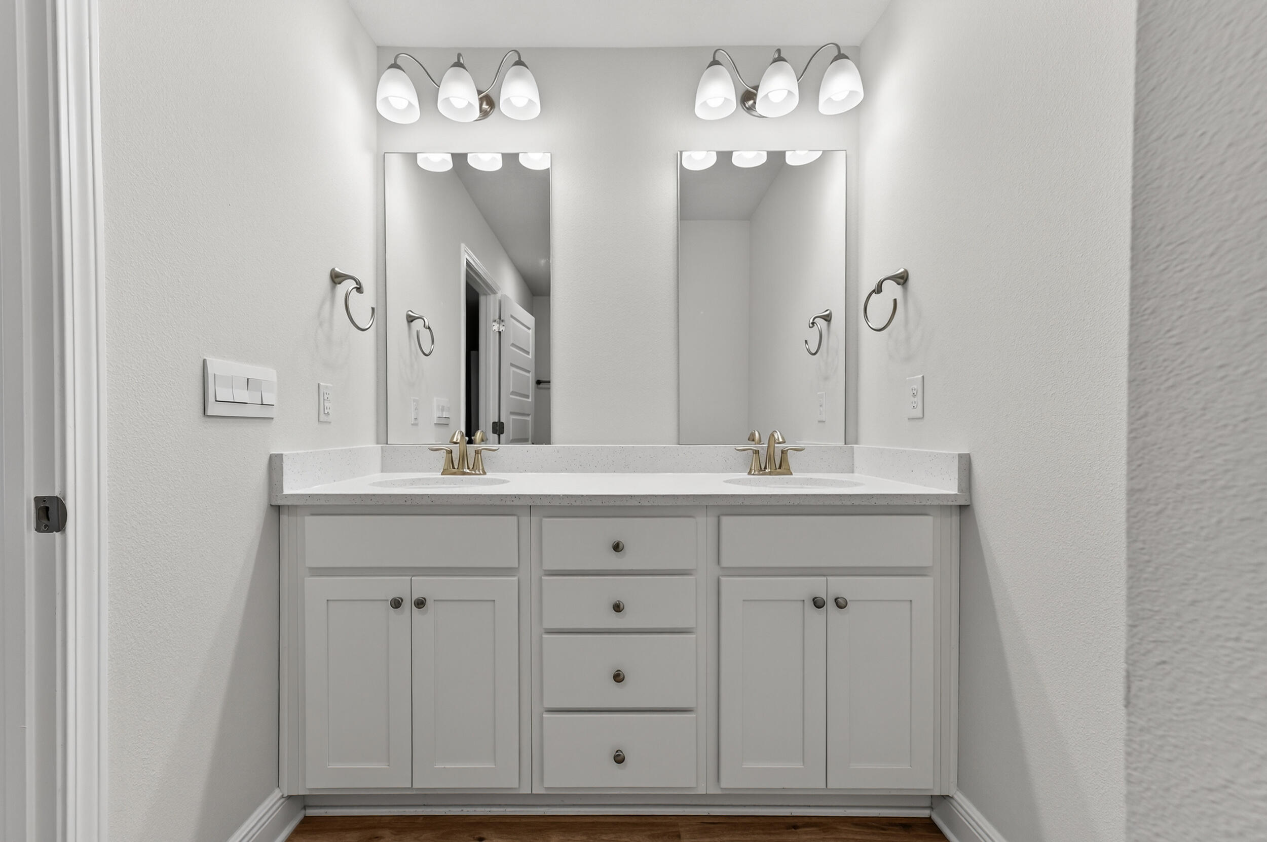 15 Redbird Loop Destin, FL 32541 - Photo 28 of 42 a bathroom with double vanity sinks a vanity a lamp and a mirror