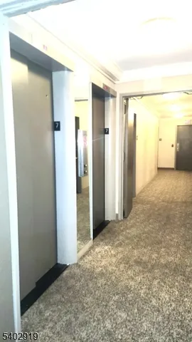 a view of a big room with closet and wooden floor