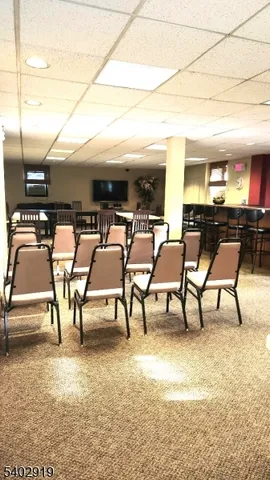 a view of a patio with dining table and chairs