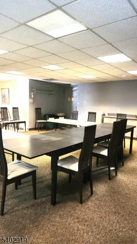 a workspace with furniture and a rug