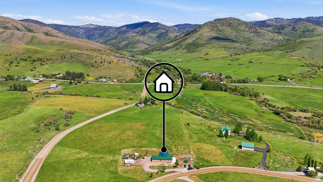 8066 North Valley View Heights Preston, ID 83263 - Photo 32 of 34 Sprawling property featuring a verdant landscape with extensive green fields and distant mountain ranges