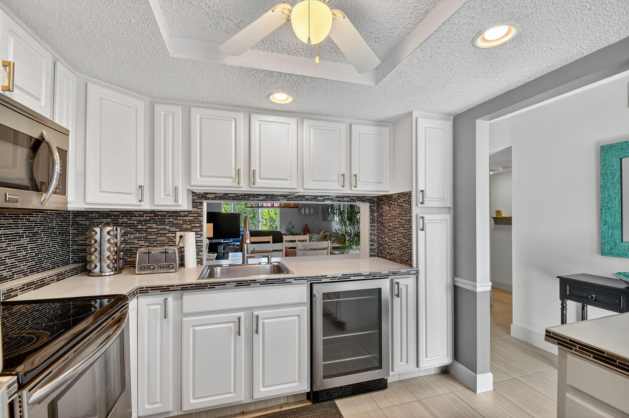 a kitchen with stainless steel appliances granite countertop a stove sink and cabinets