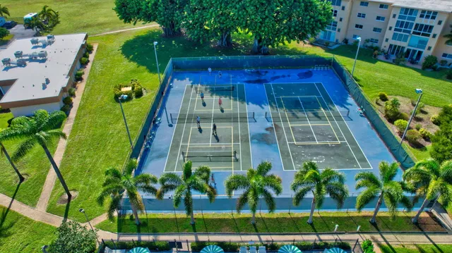 a view of a tall building with a yard