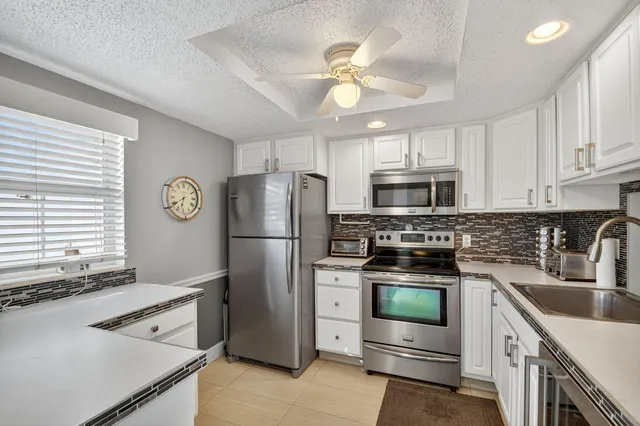a kitchen with a stove microwave and refrigerator