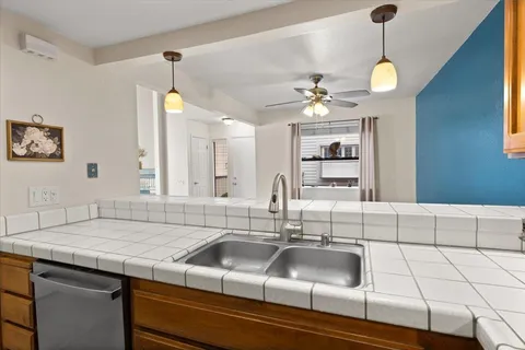 a bathroom with a sink and a chandelier