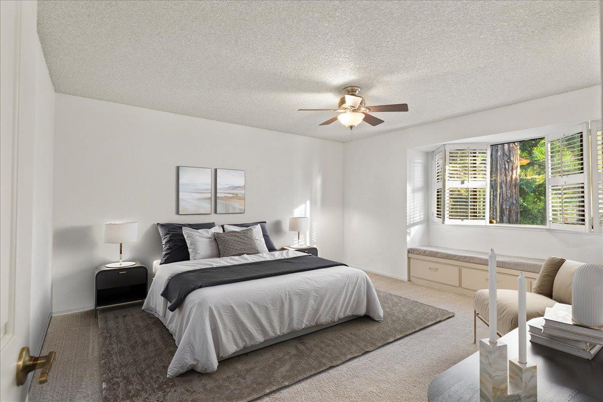 2280 Hurley Way, Unit 32 Sacramento, CA 95825 - Photo 14 of 24 a bedroom with a bed furniture and a large window