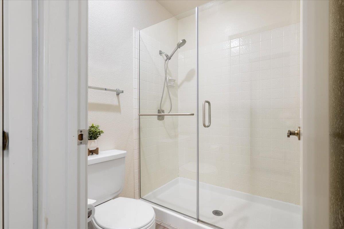 2280 Hurley Way, Unit 32 Sacramento, CA 95825 - Photo 17 of 24 a white toilet next to a bathroom