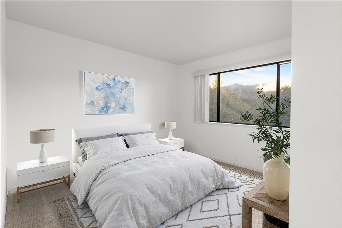 2280 Hurley Way, Unit 32 Sacramento, CA 95825 - Photo 18 of 24 a bedroom with a bed and a painting on the wall