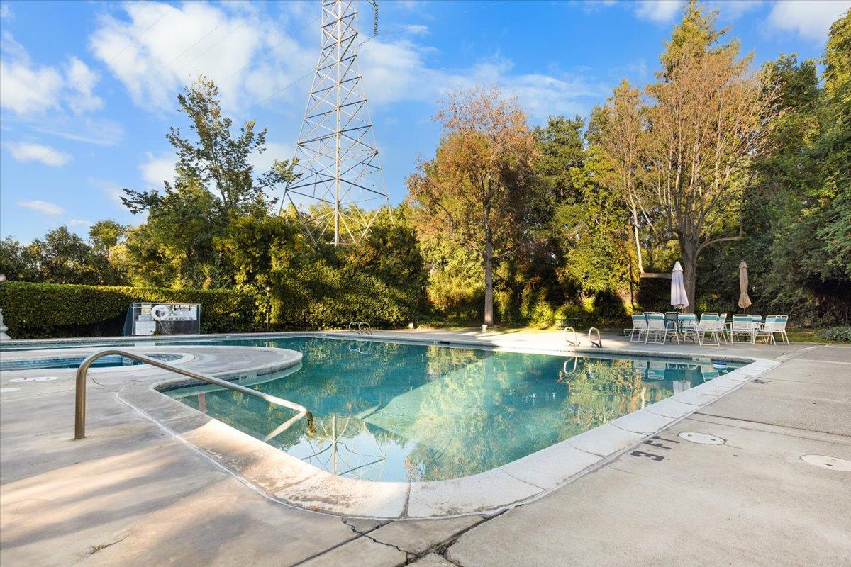 2280 Hurley Way, Unit 32 Sacramento, CA 95825 - Photo 23 of 24 a view of a swimming pool with a lounge chairs