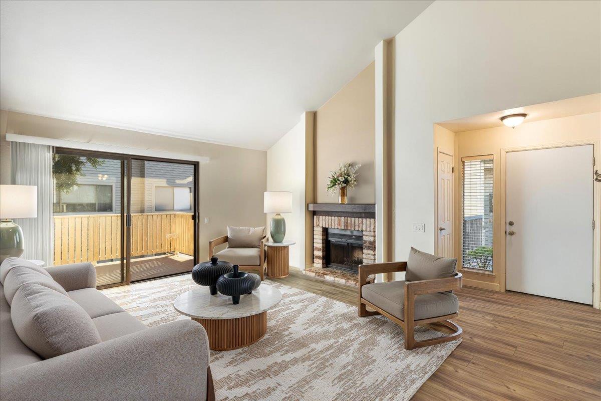 2280 Hurley Way, Unit 32 Sacramento, CA 95825 - Photo 6 of 24 a living room with furniture and a fireplace