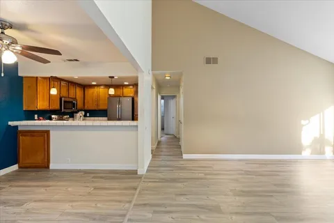 a view of kitchen with cabinets and wooden floor