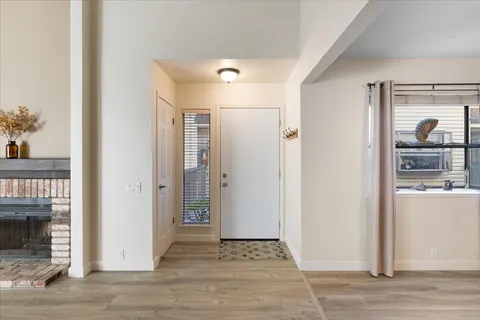 a view of a hallway with wooden shelves