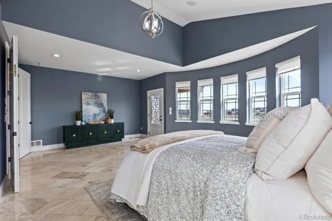 a bed room with a bed and a large window