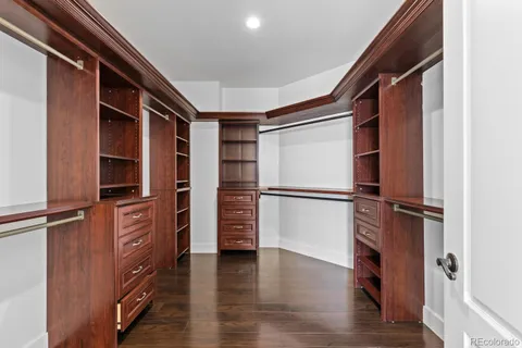 a view of walk in closet with empty racks