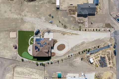an aerial view of residential house with outdoor space