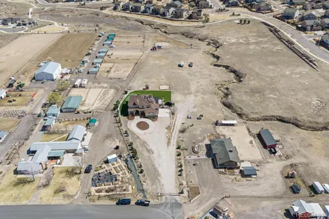 an aerial view of residential houses with outdoor space