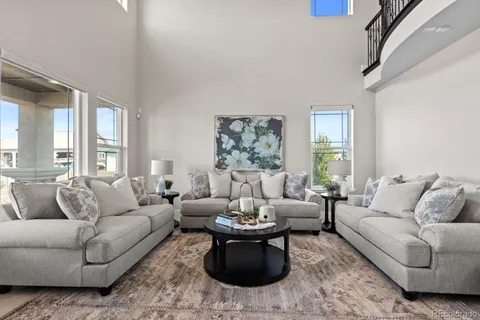 a living room with furniture or couch and a large window