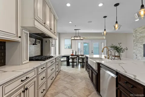 a kitchen with sink stove and cabinets
