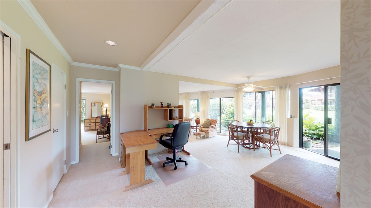 3920 Wyllie Road, Unit 6A Princeville, HI 96722 - Photo 15 of 19 a living room with furniture and large windows
