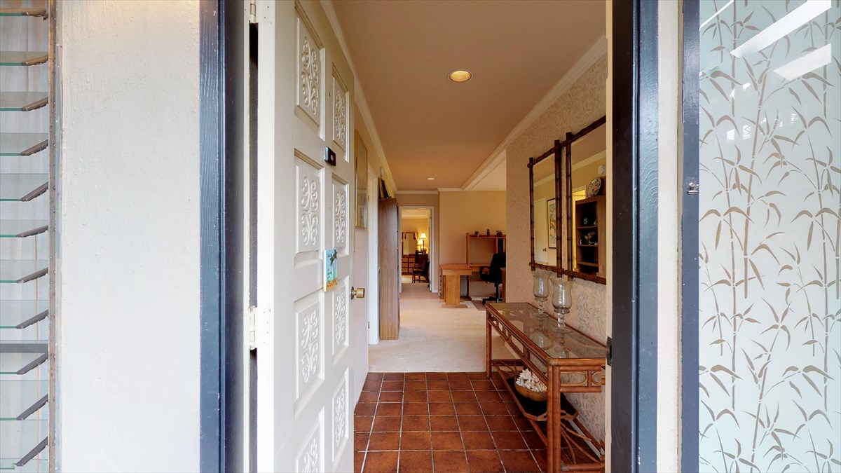 3920 Wyllie Road, Unit 6A Princeville, HI 96722 - Photo 16 of 19 a view of a hallway with a livingroom and a bathroom with a bathtub