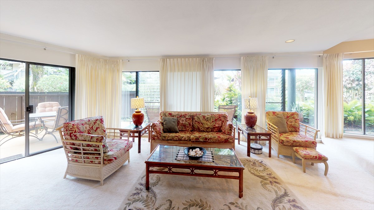 3920 Wyllie Road, Unit 6A Princeville, HI 96722 - Photo 3 of 19 a living room with furniture and a flat screen tv