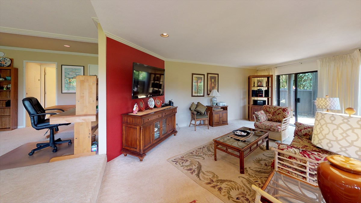 3920 Wyllie Road, Unit 6A Princeville, HI 96722 - Photo 4 of 19 a living room with furniture a window and a flat screen tv