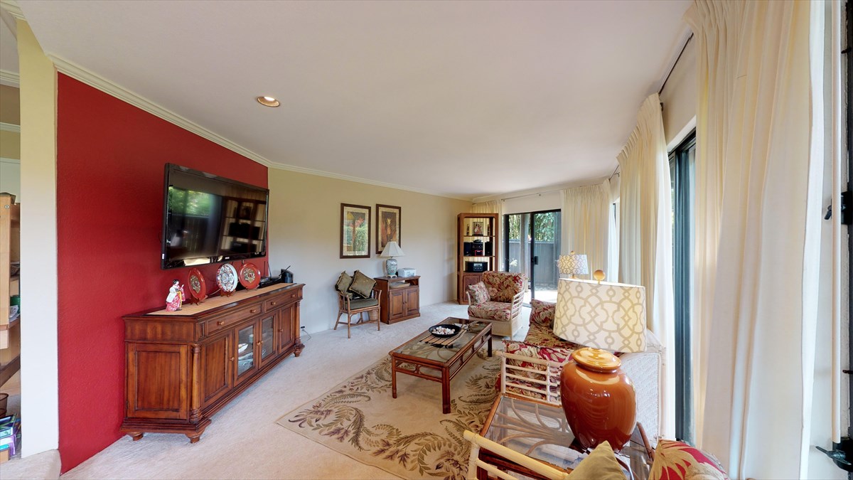 3920 Wyllie Road, Unit 6A Princeville, HI 96722 - Photo 5 of 19 a living room with furniture and a flat screen tv