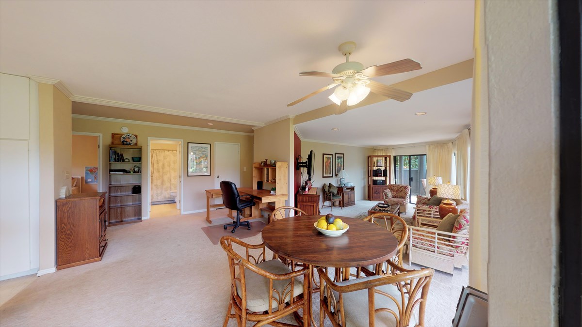 3920 Wyllie Road, Unit 6A Princeville, HI 96722 - Photo 7 of 19 a view of a dining room with furniture and chandelier