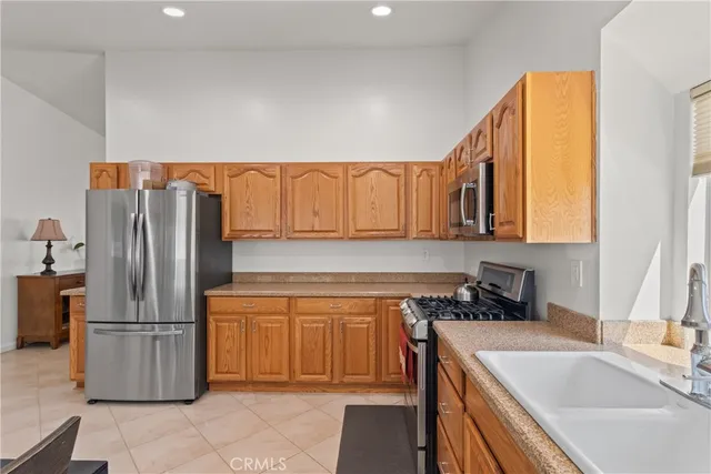 a kitchen that has a sink and a refrigerator