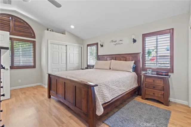 a bedroom with a bed and a night stand