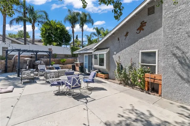 a view of pool with outdoor seating and plants