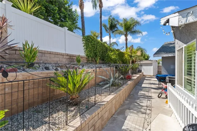 a view of a potted plants on a sidewalk