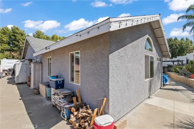 a backyard of a house with outdoor seating
