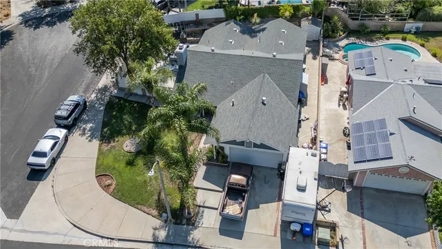 an aerial view of a house with outdoor space
