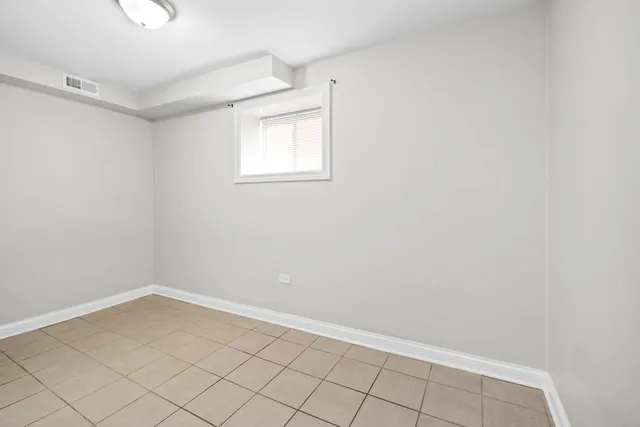 a bathroom with a sink mirror and toilet
