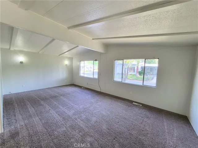 a view of an empty room and window