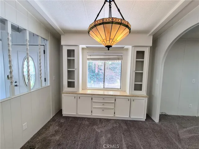 a kitchen with a stove a sink and a refrigerator