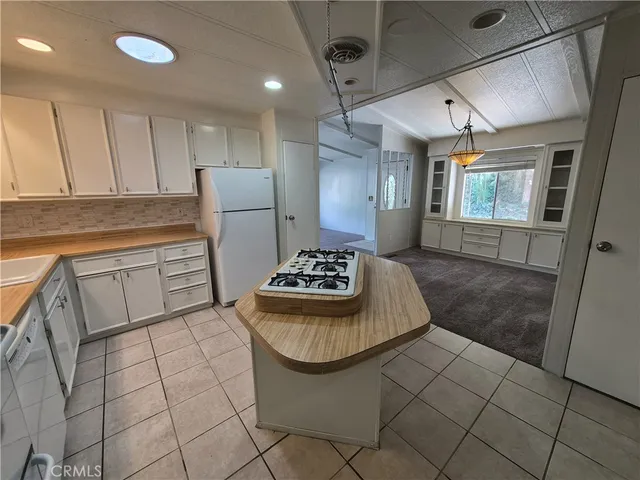 a bathroom with a granite countertop sink a toilet and bathtub