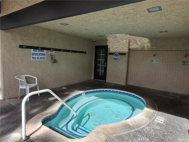 a view of a garden with swimming pool