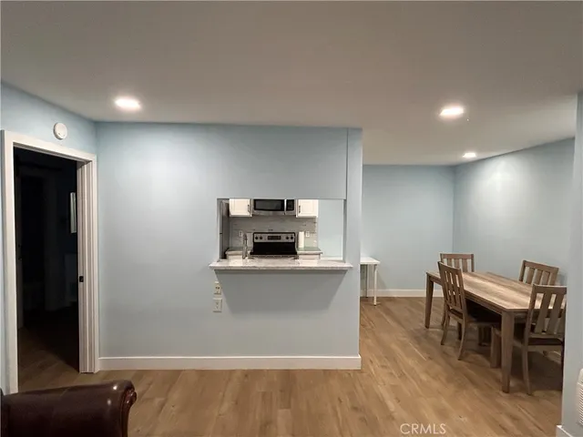 a kitchen with a sink and a refrigerator
