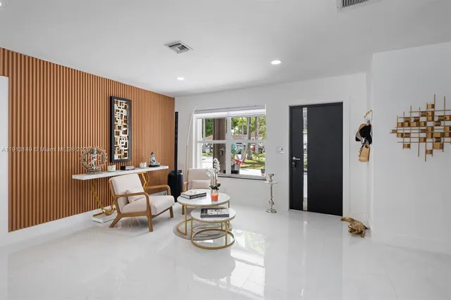 a living room with furniture and a window