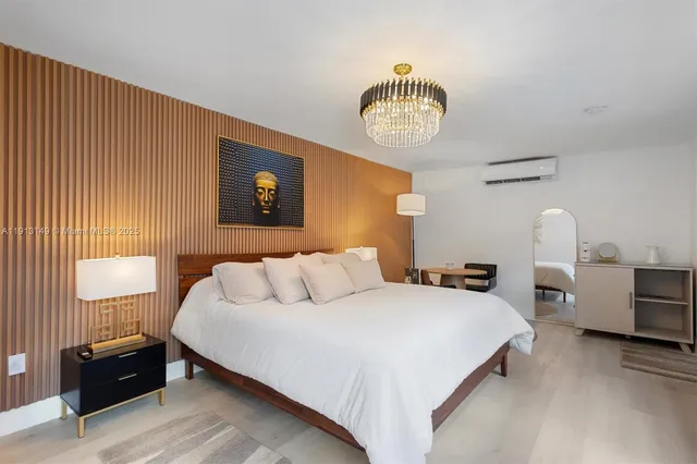 a bedroom with bed and a table