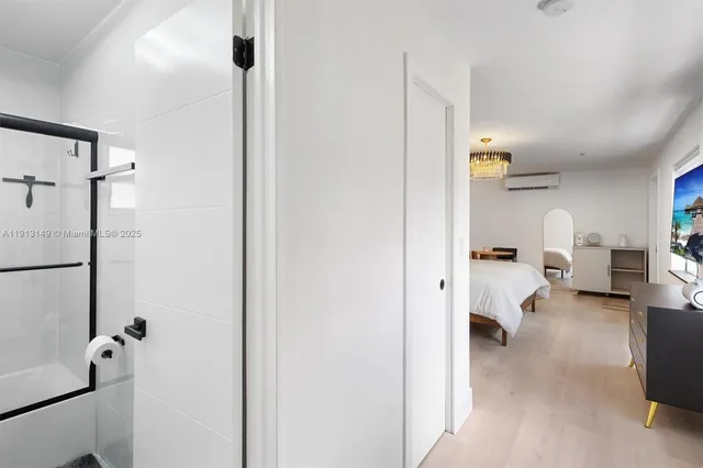 a view of hallway with livingroom and furniture