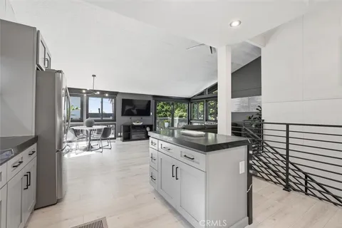 a kitchen with stainless steel appliances granite countertop a stove and a sink