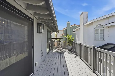 a view of balcony and deck with wooden floor