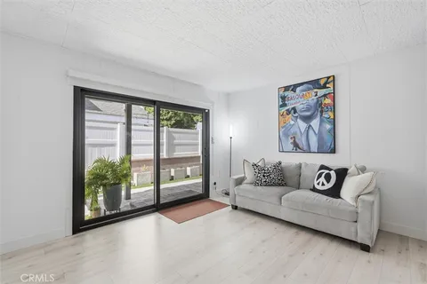a living room with furniture and a large window with outer view