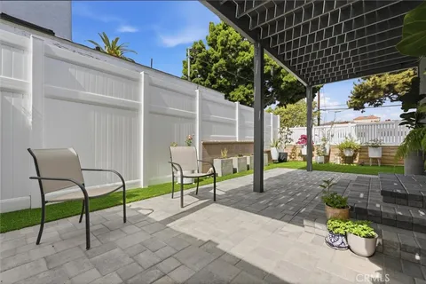 a view of a chairs and table in the patio