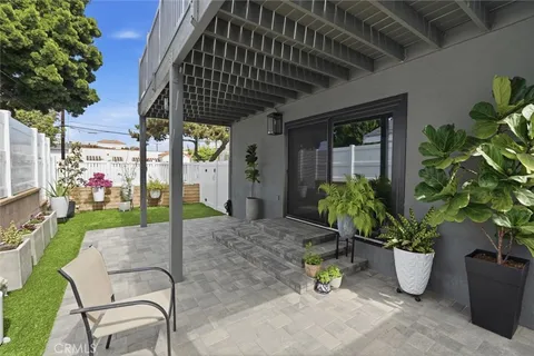 a potted plant sitting in front of a house