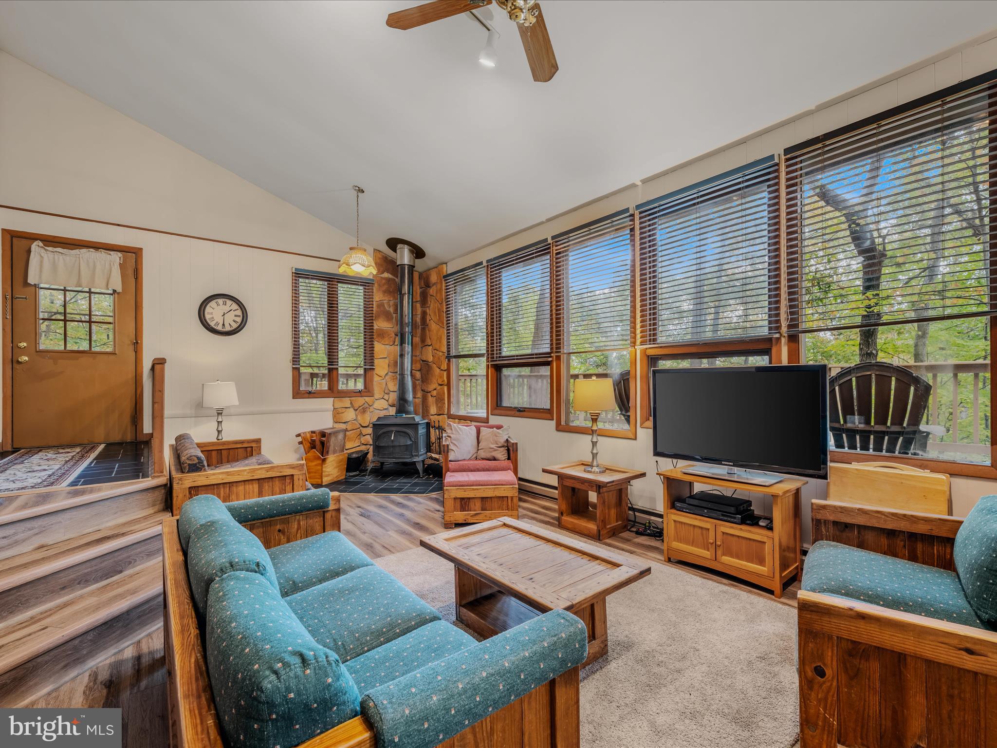 35 Warbler's Way Berkeley Springs, WV 25411 - Photo 12 of 54 a living room with furniture and a flat screen tv